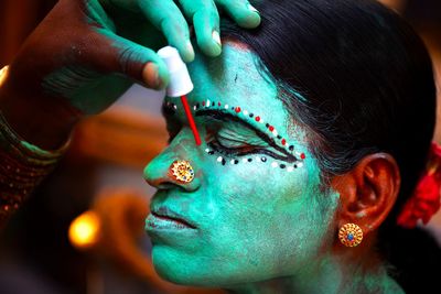 Close-up of woman wearing face paint