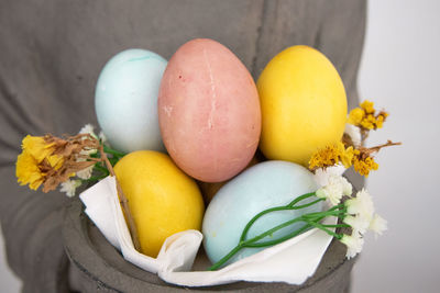 High angle view of multi colored eggs on plant