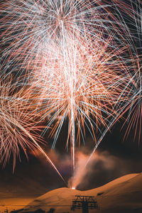 Firework display at night