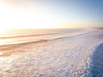 Scenic view of beach against clear sky