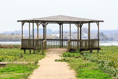 Gazebo on field against clear sky