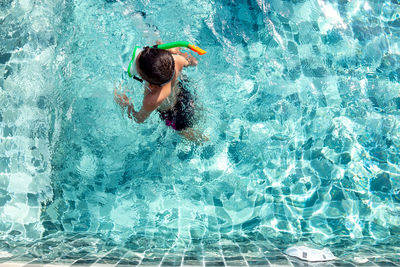 High angle view of man swimming in pool