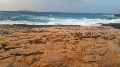 Scenic view of beach against sky