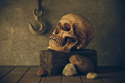 Close-up of human skull on wall