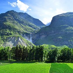 Scenic view of mountains against cloudy sky