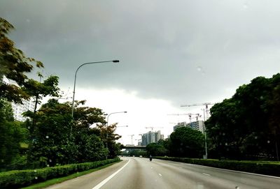 View of road against cloudy sky