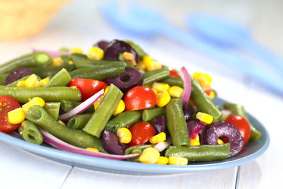 Close-up of chopped vegetables in plate on table