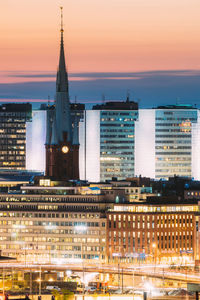 Buildings in city at night