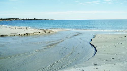 Scenic view of beach against sky