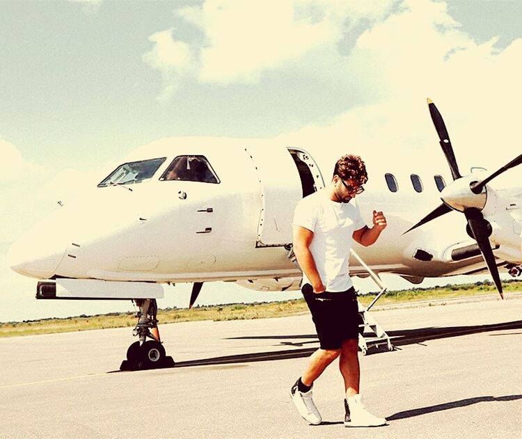 airplane, full length, transportation, one person, day, skill, men, sky, outdoors, airport, real people, young adult, adult, people