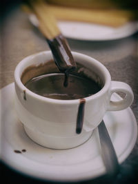 Close-up of coffee cup on table