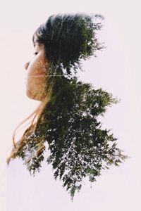 Close-up of woman against white background