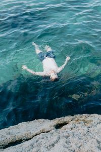 Floating in blue sea