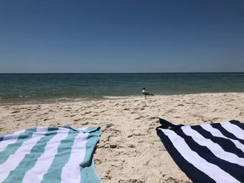 Scenic view of beach against clear sky