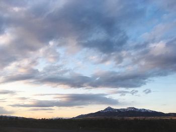 Scenic view of dramatic sky over landscape