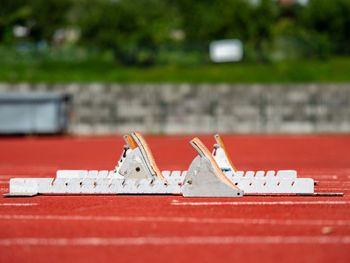 Worn out starting blocks on running tracks. red running tracks lanes at track and field stadium. 