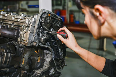 Cropped image of man repairing car