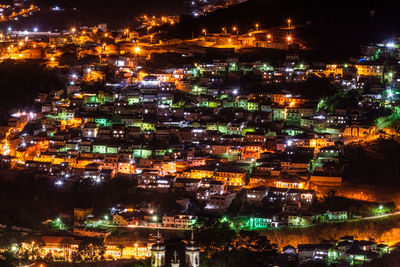 High angle view of illuminated buildings at night