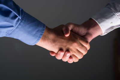 Close-up of hands over black background
