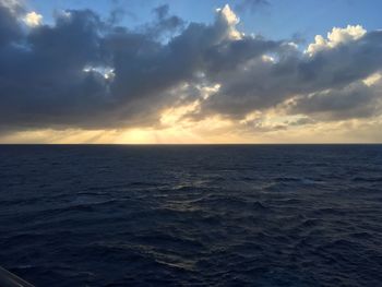 Scenic view of sea against dramatic sky