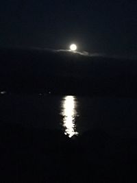 Scenic view of sea against sky at night