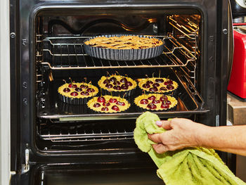 Cropped hand of man preparing food