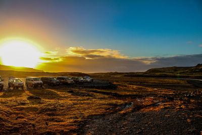 Scenic view of land against sky during sunset