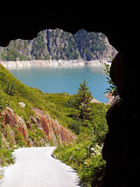 View of lake seen through cave