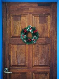 Christmas decorations on wooden door