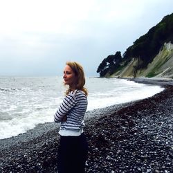Portrait of woman standing on shore
