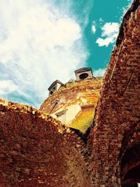 Low angle view of old ruins against sky