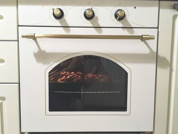 Meat baking in white oven