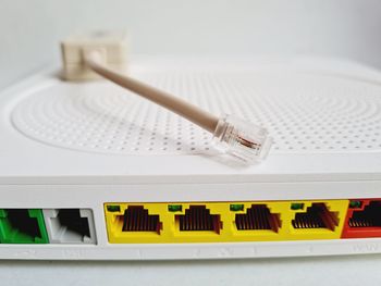 Back of a modem router with colored network cables