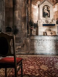 View of empty chairs and table in building