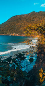 Scenic view of sea against blue sky