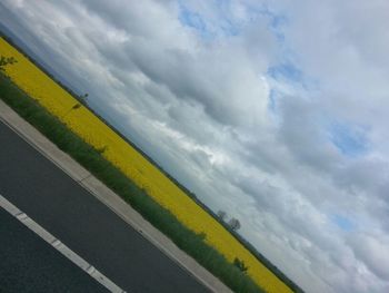 Road against cloudy sky