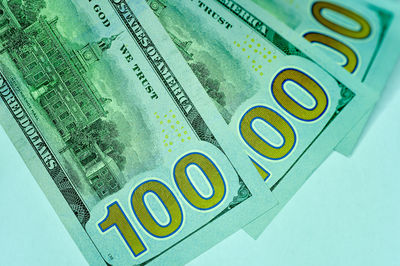 Close-up of coins over white background