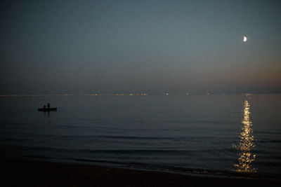 Scenic view of sea against sky at night