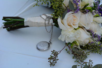 Close-up of white roses on table