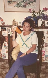 Young woman sitting on floor