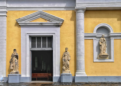 Low angle view of statue against building