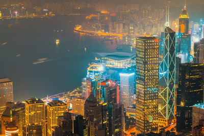 Aerial view of illuminated buildings in city at night