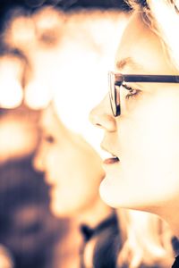 Close-up of young woman wearing eyeglasses