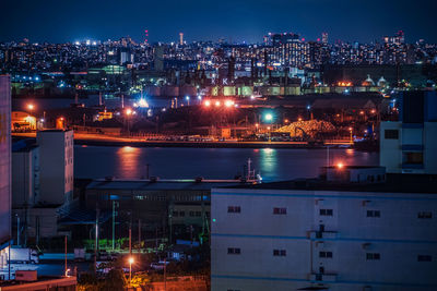 Illuminated cityscape at night