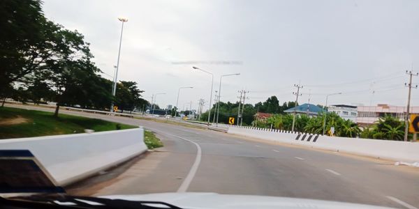 Street seen through car windshield