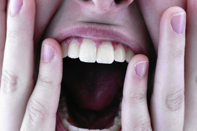 Cropped image of woman mouth open
