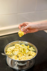 Cropped hand of person preparing food