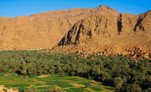 Scenic view of landscape and mountains against sky