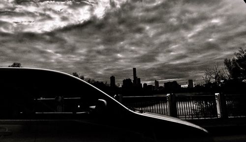 Cloudy sky above city at sunset