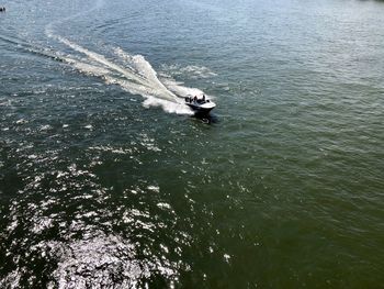 High angle view of people on sea